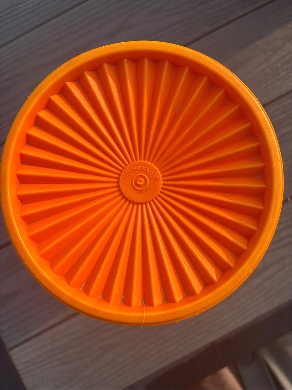 Tupperware Orange Storage Container with Decorative Emblem